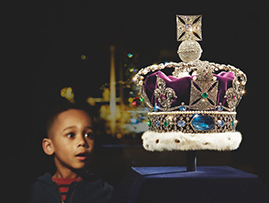 A child gazing at jewels at tower of london
