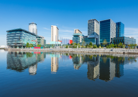Wide angle view of modern architecture at Salford Quays on a clear summers day.