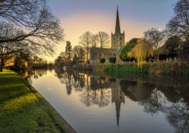 Shakespeare's burial place holy trinity church reflections in the river Avon at sunrise in Stratford upon avon